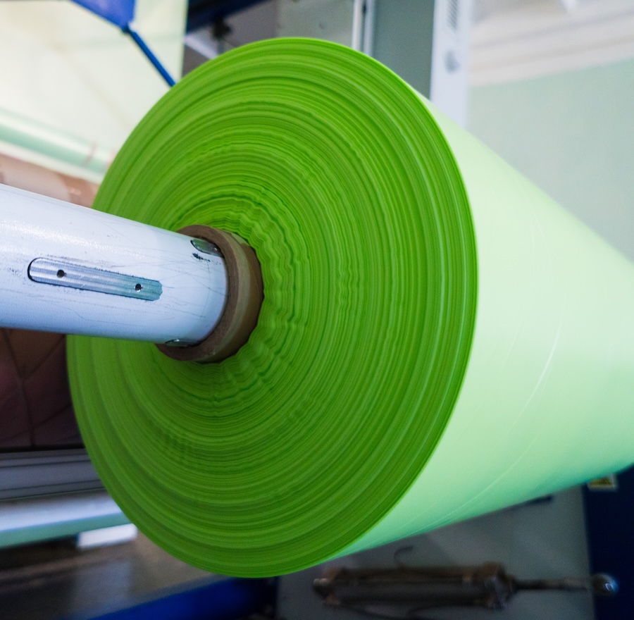 green roll of polyethylene or polypropylene bags